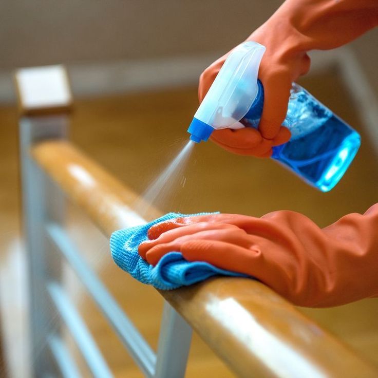 Professional disinfectant cleaning of white carpet in Austin apartment — certified cleaner using eco-safe spray & brush for deep germ removal