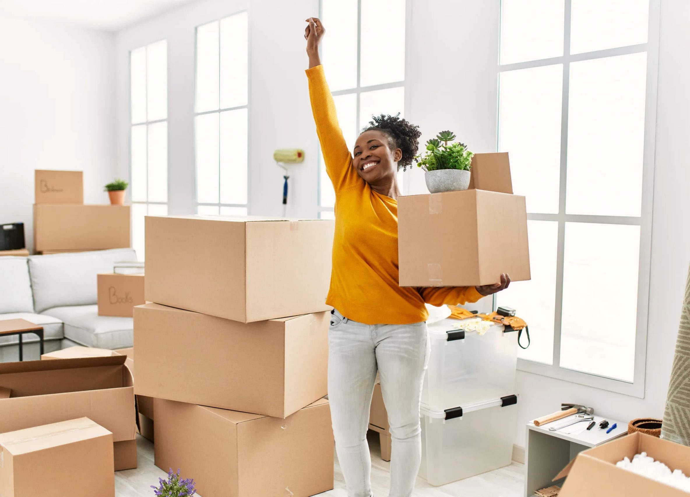 Happy new resident celebrating move-in after professional apartment cleaning in Austin — Gleaming Space ensures spotless floors, dust-free surfaces & eco-safe prep