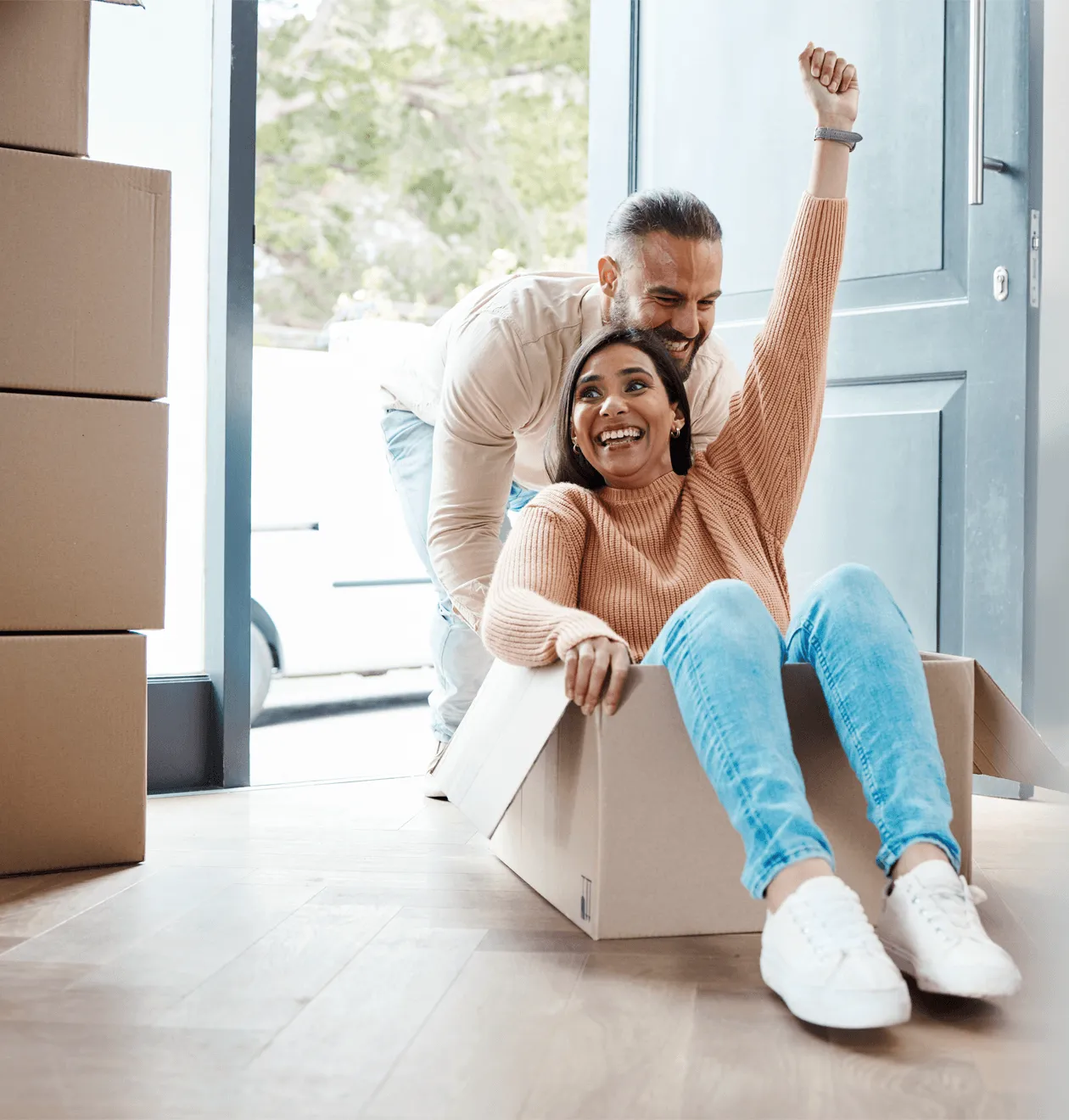 Happy couple celebrating after professional move-in cleaning in Seattle — stress-free apartment ready for new beginnings with Gleaming Space