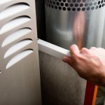 Air duct inspection and cleaning process using a negative air machine and HEPA vacuuming for dust-free environment.