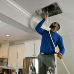 Professional technician performing air duct cleaning and hvac vent cleaning as part of a full system furnace cleaning service in CO, TX, and WA.
