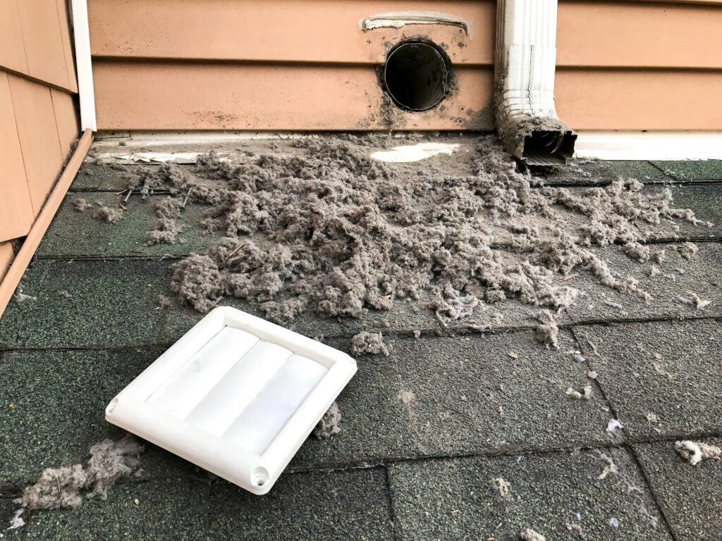 Excessive dryer vent lint buildup extracted during residential cleaning service, demonstrating critical fire prevention maintenance and airflow restoration needed for Austin home safety