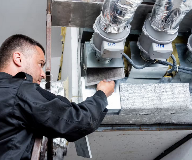 Professional technician performing a deep hvac inspection and furnace cleaning service in CO, TX, and WA to remove dust allergens and soot.